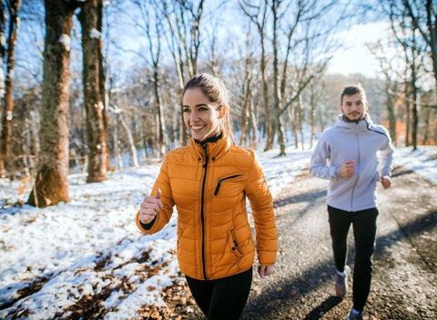 Couple running outside. How to exercise in winter weather - Absolute Collagen