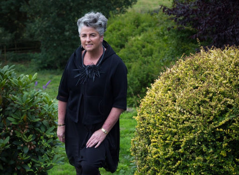 Absolute Collagen founder, Maxine Laceby, standing in garden.